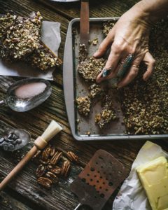 overhead of hands serving toffee