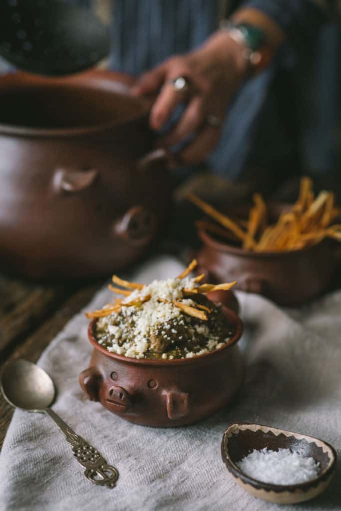 woman with bowl of chili verde