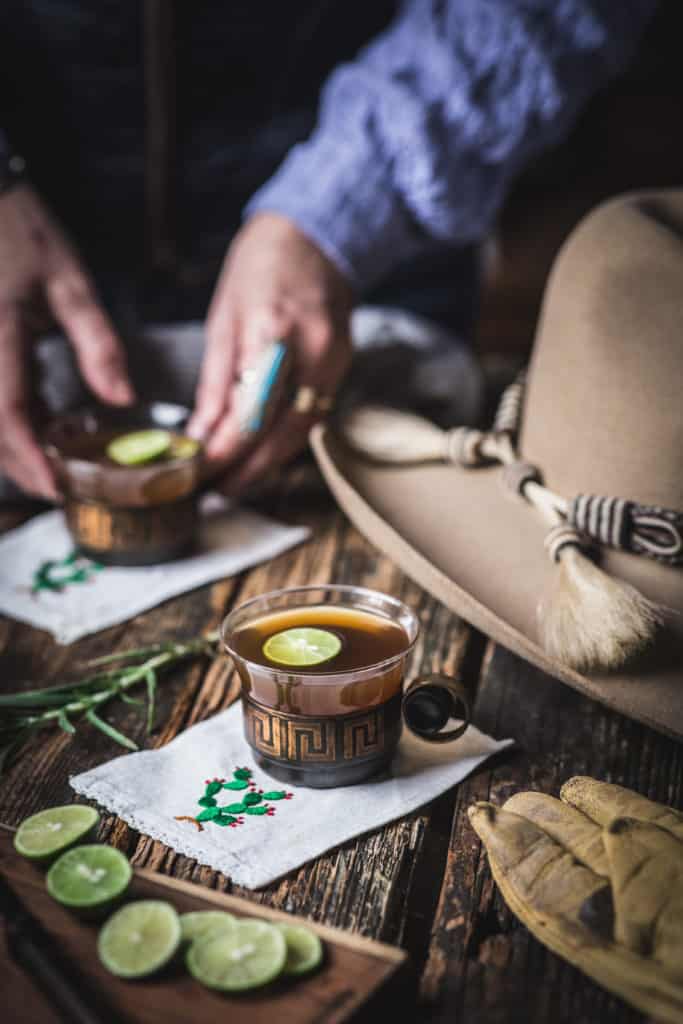 woman's hands with cup of hot bourbon tea