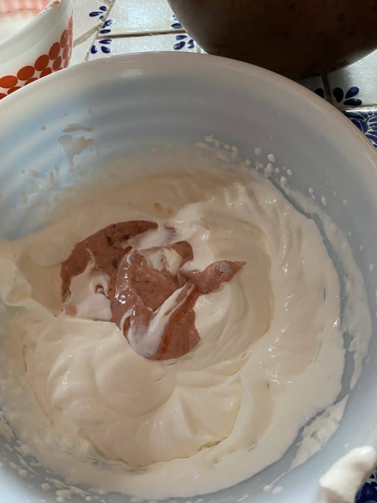 bowl with whipped cream and strawberry filling