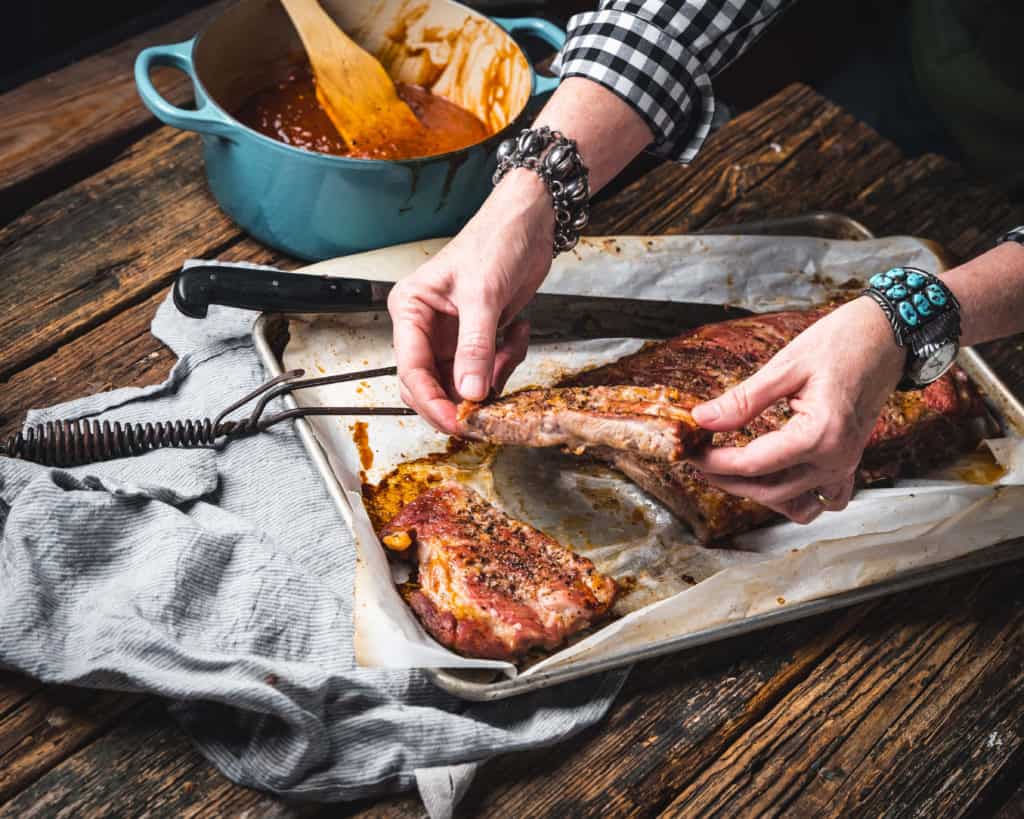 woman holding pork rib