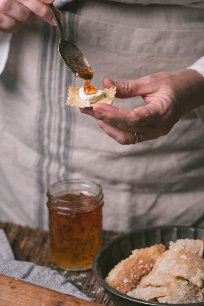 serving hot pepper jelly on cracker