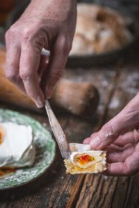 serving hot pepper jelly on cracker