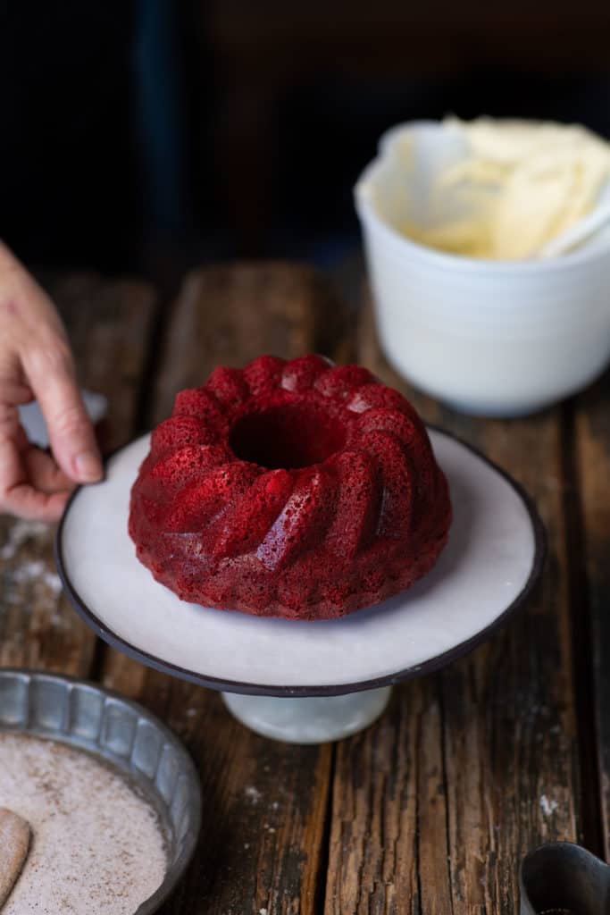 small red cake on platter