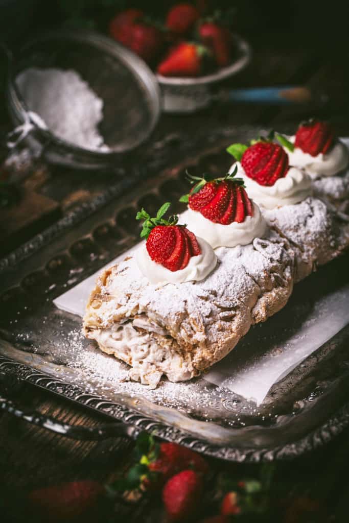 close up view of strawberry meringue roll