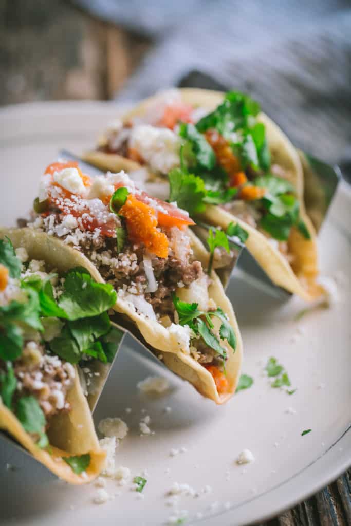 beef picadillo tacos on a plate