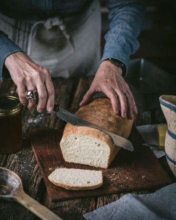 woman slicing Loaf of Buttermilk Bread