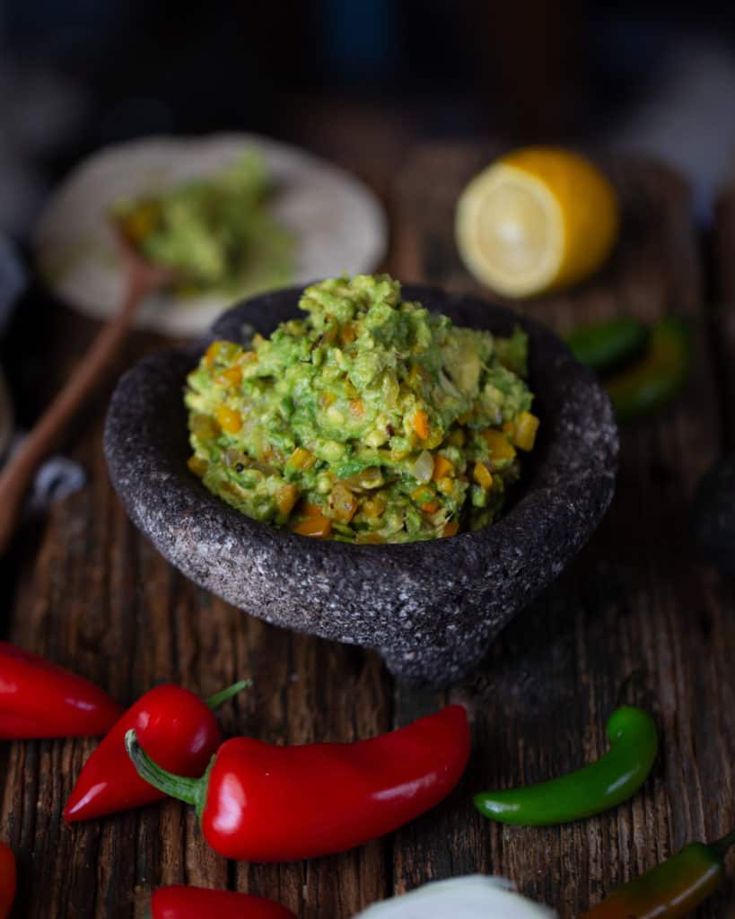 bowl of roasted vegetable avocado salsa
