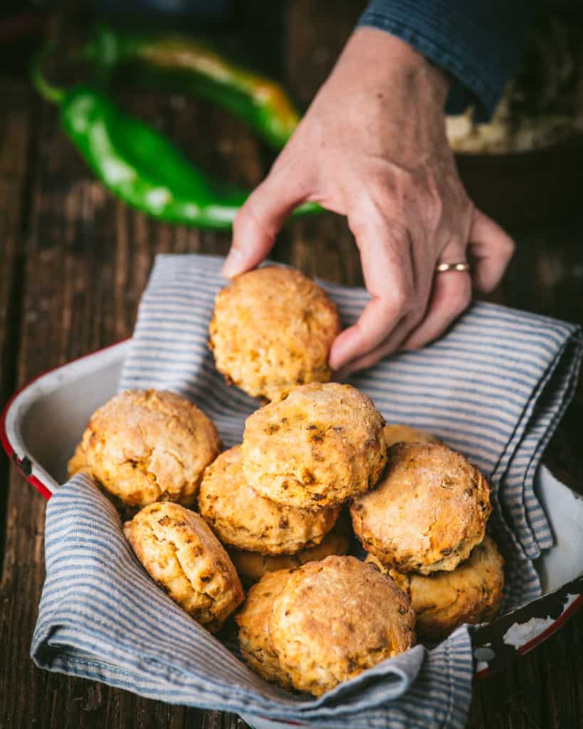 hand picking up chorizo biscuit