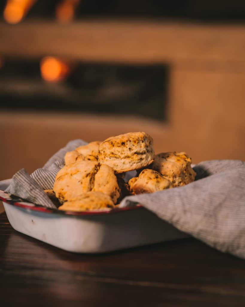 tray of chorizo biscuits in front of fire