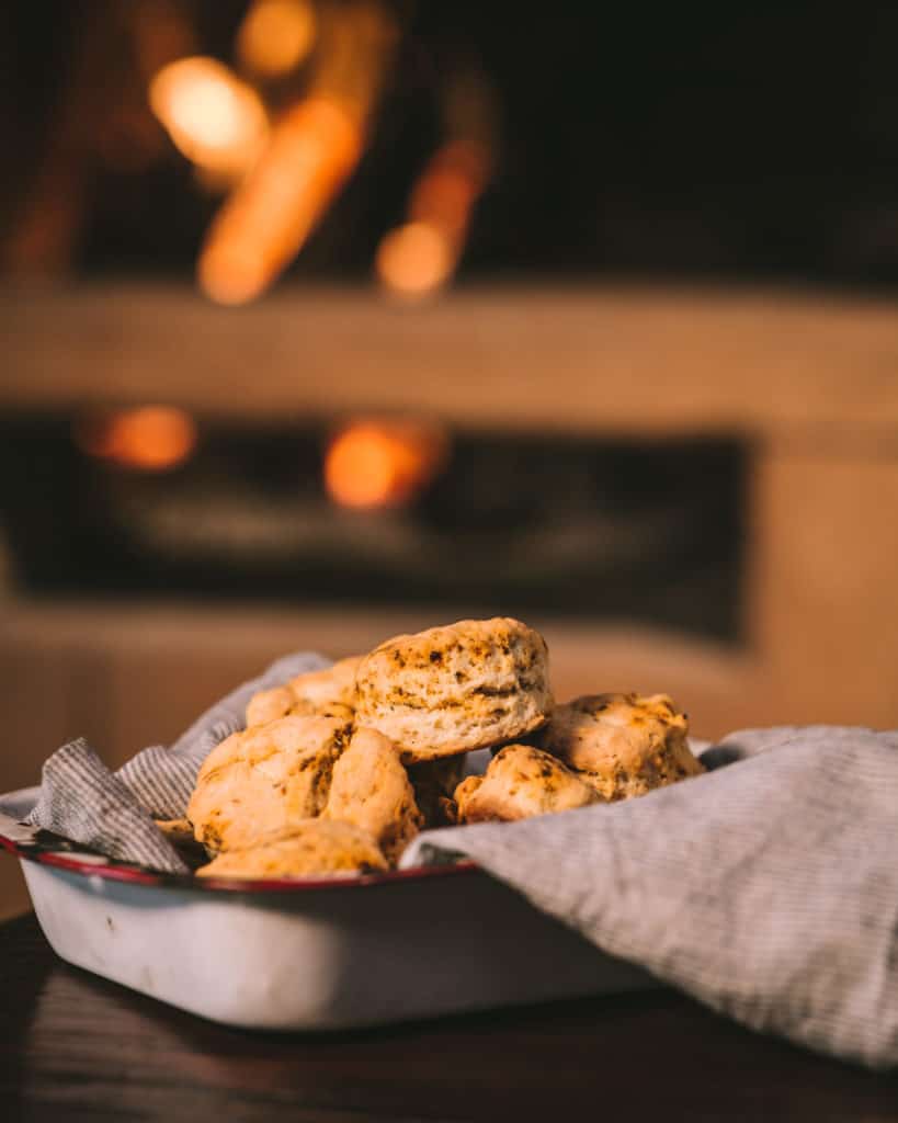 tray of chorizo biscuits in front of fire
