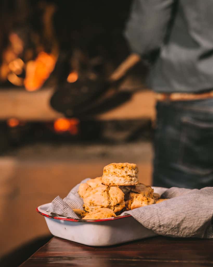 tray of chorizo biscuits in front of fire