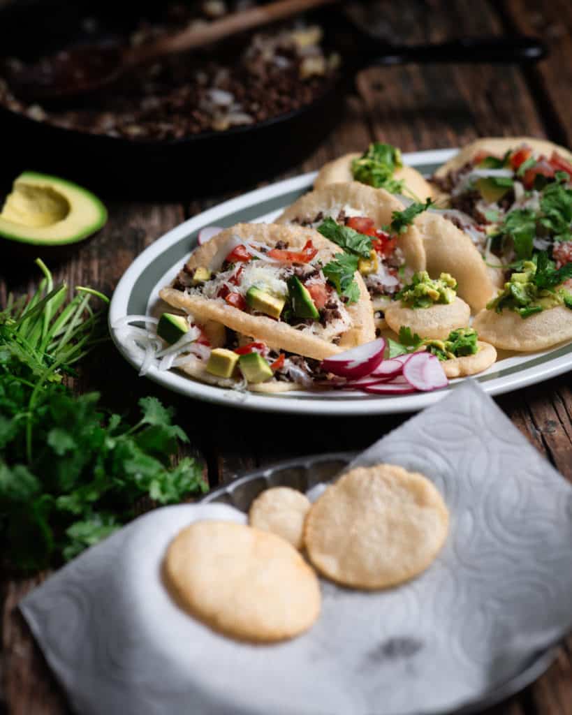 platter of puffy tacos shells