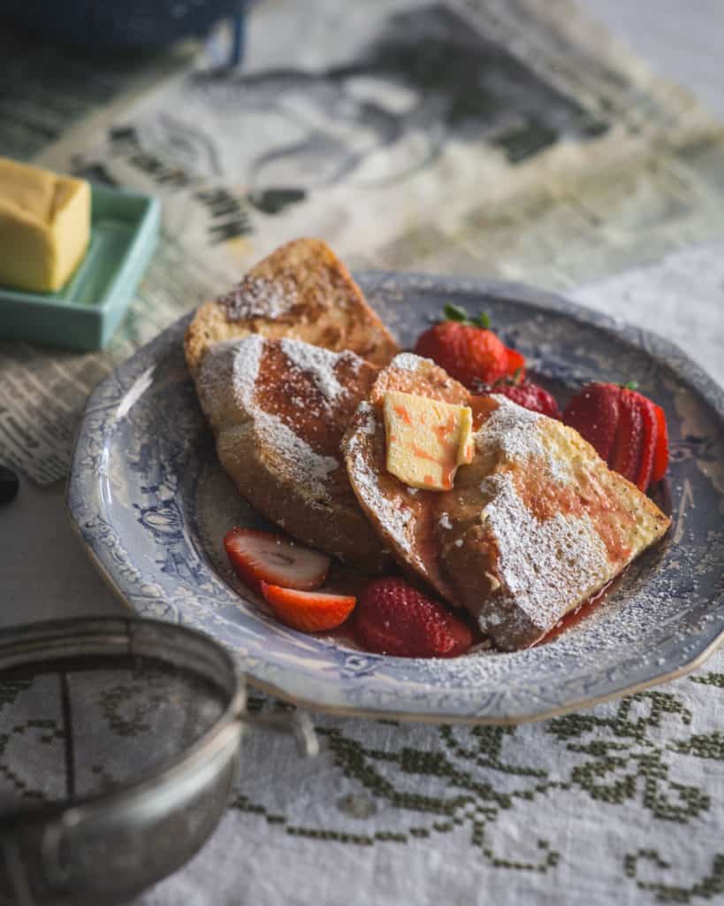 plate of french toast with strawberry syrup