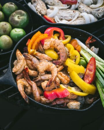 pan of shrimp and bell peppers on grill