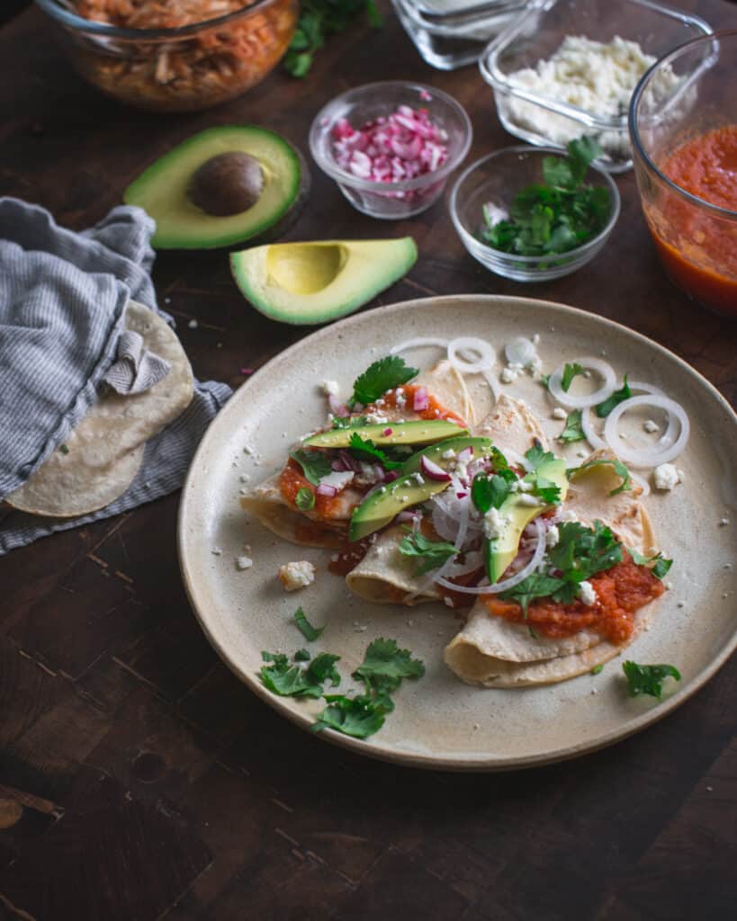 plate of tacos with tomato sauce