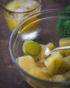 bowl of ice cubes with sliced jalapeno