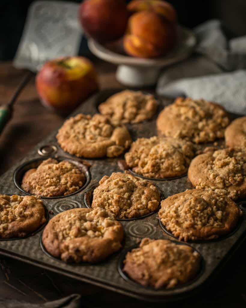 tray of peach streusel muffins
