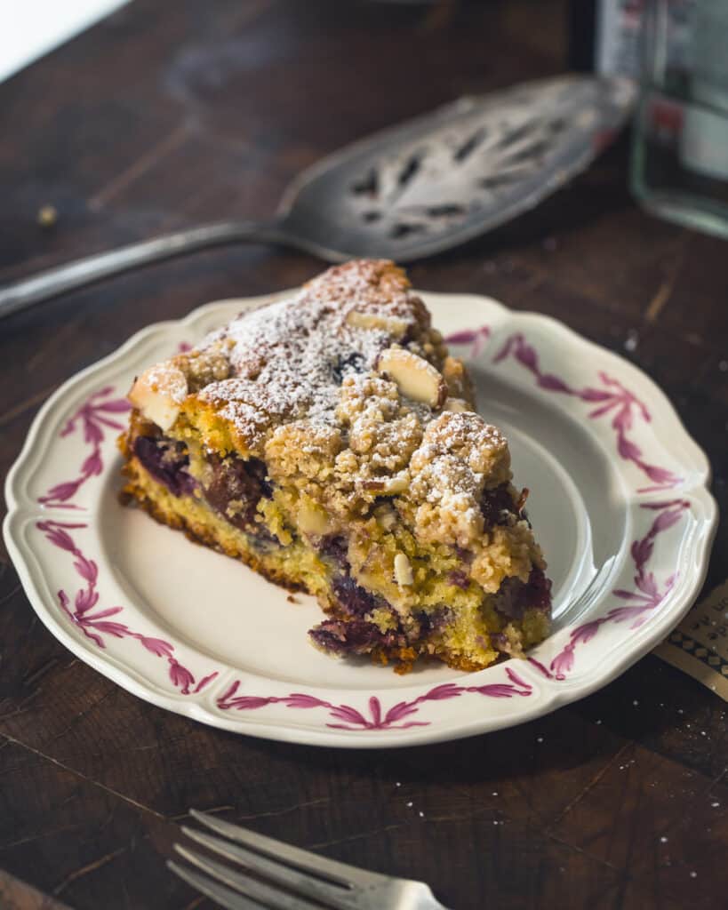 slice of Summer Cherry Crunch Cake on plate