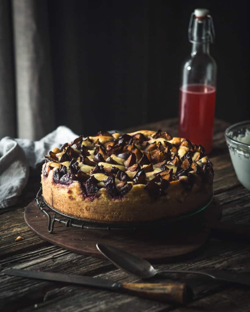 plum topped cheesecake on table