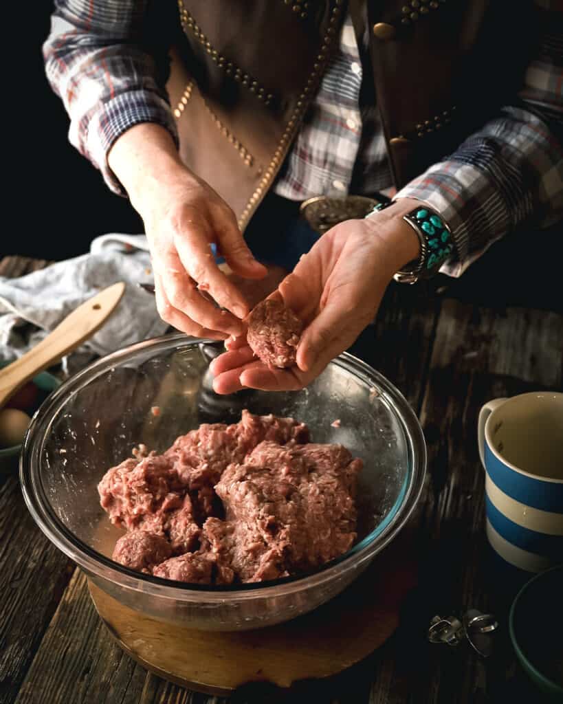woman making meatballs