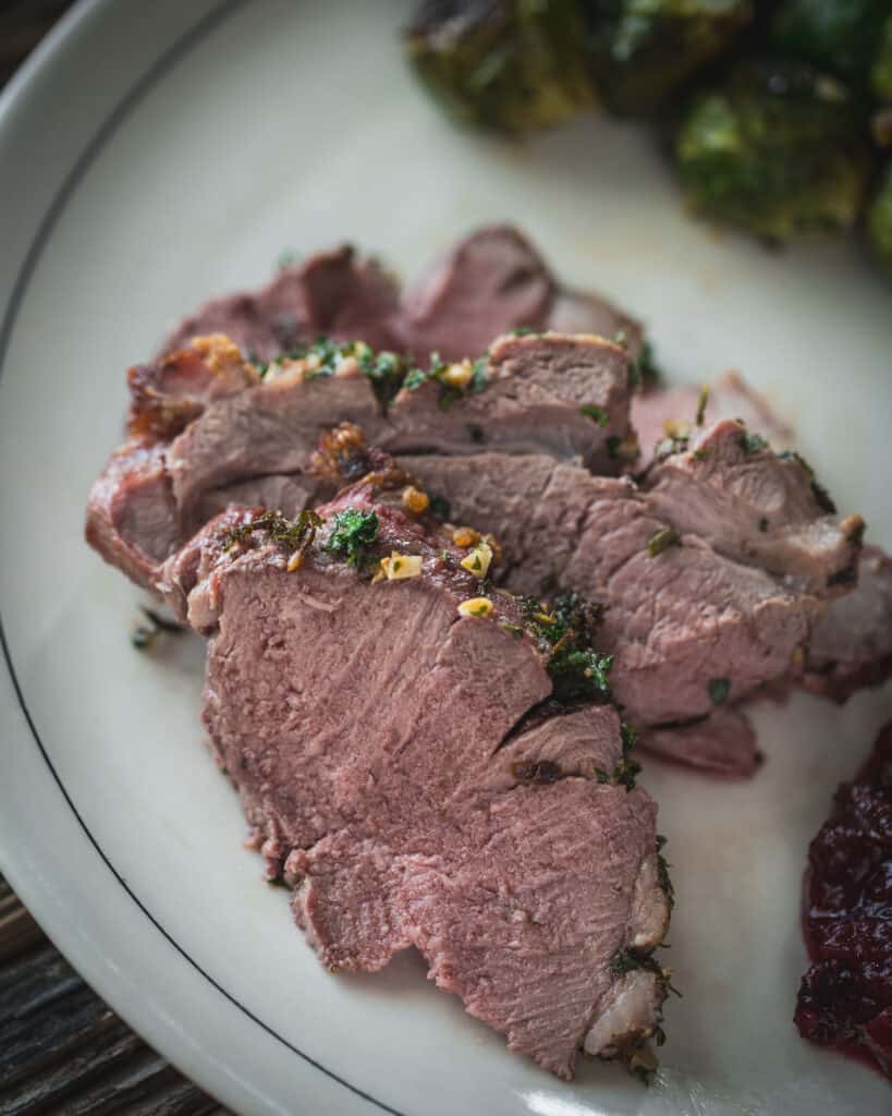 close up of Roasted Leg of Lamb with Brussels Sprouts
