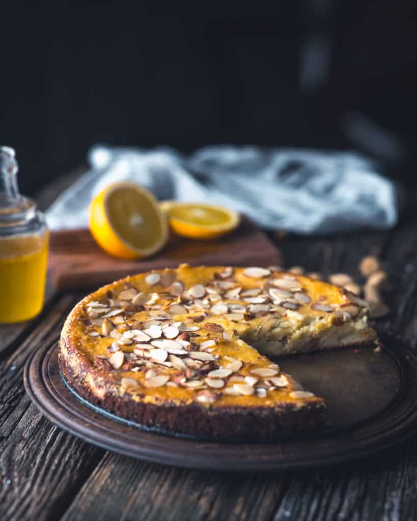 orange almond cake with a wedge removed