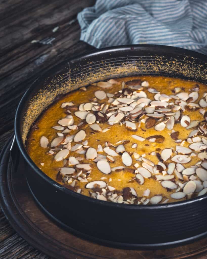 overhead pic of whole orange almond cake in pan