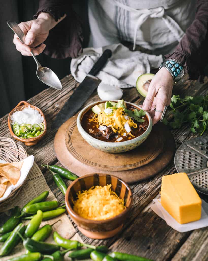 woman serving chili con carne