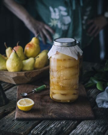 woman holding jar of honey ginger pears