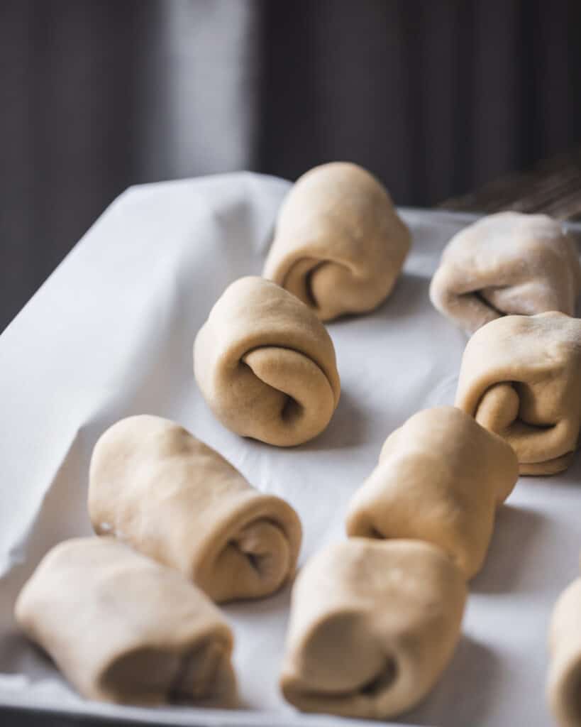 rolled up dough on a pan