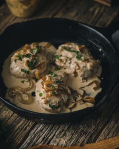 close up view of mustard chicken in pan