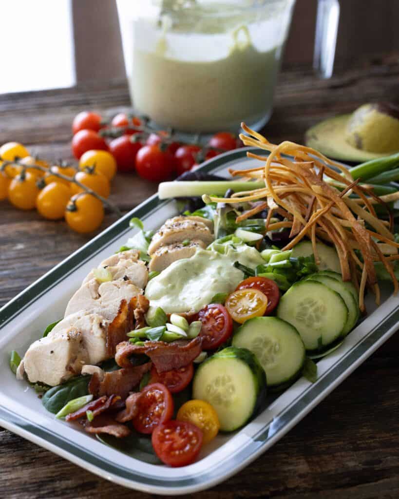platter of salad with avocado ranch dressing