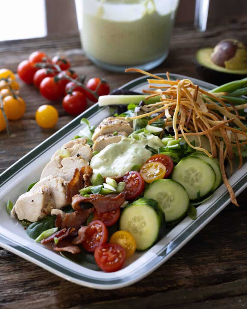 platter of salad with avocado ranch dressing