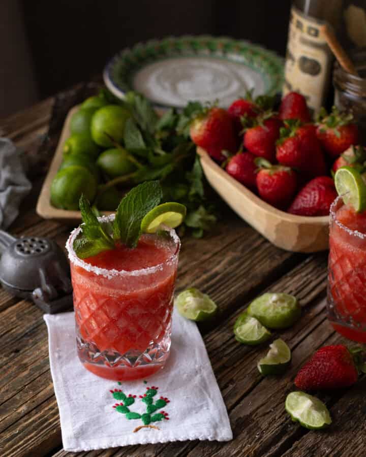 Strawberry Margarita with mint in glass with fruit
